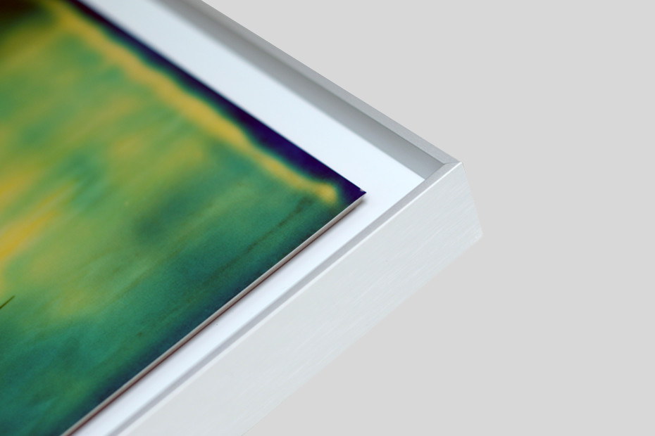Perfect for prints that have been dry mounted and don’t necessarily require glazing. The print is set back slightly below the face of the frame to prevent damage. It is mounted to Dibond or aluminium for rigidity and then floated in the frame with a space between the work and the frame moulding.